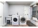 Functional laundry room with a utility sink, washer, and dryer at 5221 Holmby Ave, Las Vegas, NV 89146