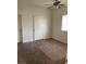 Bedroom with neutral carpet and ceiling fan with light fixture at 5250 S Rainbow Blvd # 1010, Las Vegas, NV 89118