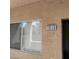 Exterior detail of an apartment with window, door, and unit number 1010 on the wall at 5250 S Rainbow Blvd # 1010, Las Vegas, NV 89118