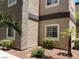 Exterior corner of an apartment building featuring two windows and desert landscaping at 5250 S Rainbow Blvd # 1010, Las Vegas, NV 89118