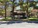 Apartment complex exterior with mature trees and well-maintained landscaping at 5250 S Rainbow Blvd # 1010, Las Vegas, NV 89118