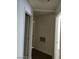 Hallway with dark wood-style floors and neutral walls leading to other rooms at 5250 S Rainbow Blvd # 1010, Las Vegas, NV 89118