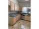This updated kitchen provides granite countertops, stainless steel appliances, and tile flooring at 5250 S Rainbow Blvd # 1010, Las Vegas, NV 89118