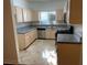 The remodeled kitchen provides granite countertops, and ample cabinet space at 5250 S Rainbow Blvd # 1010, Las Vegas, NV 89118