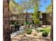 Community playground with slide, fence, and mature trees at 5250 S Rainbow Blvd # 1010, Las Vegas, NV 89118