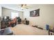 Bedroom features a ceiling fan, natural light and sports themed decor at 5628 Ridgeland St, North Las Vegas, NV 89031