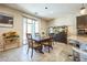 Elegant dining area adjacent to the kitchen, featuring a wooden table set and contemporary decor at 5628 Ridgeland St, North Las Vegas, NV 89031