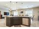 Open concept kitchen with granite counters, stainless steel appliances, and pendant lighting at 5628 Ridgeland St, North Las Vegas, NV 89031
