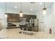 Spacious kitchen with granite counters, a stylish backsplash, and stainless steel appliances at 5628 Ridgeland St, North Las Vegas, NV 89031