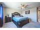 Main bedroom with ceiling fan, an ornate headboard and a relaxing atmosphere at 5628 Ridgeland St, North Las Vegas, NV 89031