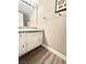 Bathroom with a single sink vanity, granite countertop, and towel rack at 6250 W Flamingo Rd # 103, Las Vegas, NV 89103