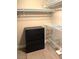 Walk-in closet featuring a dark dresser and wire shelving at 6250 W Flamingo Rd # 103, Las Vegas, NV 89103