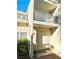 Exterior of the property showing the front door and balcony above at 6250 W Flamingo Rd # 103, Las Vegas, NV 89103