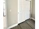 Hallway with sliding closet doors and new wood flooring at 6250 W Flamingo Rd # 103, Las Vegas, NV 89103