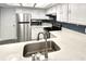Kitchen featuring stainless steel appliances, white cabinets, and white countertops at 6250 W Flamingo Rd # 103, Las Vegas, NV 89103