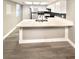 Open-concept kitchen with white cabinets, stainless steel appliances, and a breakfast bar at 6250 W Flamingo Rd # 103, Las Vegas, NV 89103