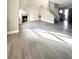 Spacious living room with hardwood-style floors, a fireplace, and staircase at 6250 W Flamingo Rd # 103, Las Vegas, NV 89103