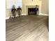 An open-concept living room features wood flooring and a fireplace at 6250 W Flamingo Rd # 103, Las Vegas, NV 89103