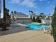 Refreshing community pool surrounded by lounge chairs and well-maintained landscaping at 6250 W Flamingo Rd # 103, Las Vegas, NV 89103
