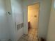 View into the downstairs bathroom, with pink vanity and beige tile floors at 6250 W Flamingo Rd # 157, Las Vegas, NV 89103