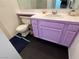 Bathroom featuring single sink vanity, tiled countertop and toilet at 6250 W Flamingo Rd # 157, Las Vegas, NV 89103
