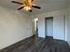 Bedroom features wood-look floors, a ceiling fan, and closet space for storage at 6250 W Flamingo Rd # 157, Las Vegas, NV 89103