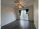 Bedroom features wood-look floors, ceiling fan and sliding glass doors to balcony at 6250 W Flamingo Rd # 157, Las Vegas, NV 89103