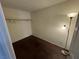 Image of a closet space with wood floor, a single hangar, and wooden shelves at 6250 W Flamingo Rd # 157, Las Vegas, NV 89103