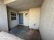 View of the front entrance, with blue door, small window, and small round window above at 6250 W Flamingo Rd # 157, Las Vegas, NV 89103