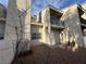 Exterior angle of condo showing balcony, with a low maintenance gravel yard with a small planter box at 6250 W Flamingo Rd # 157, Las Vegas, NV 89103