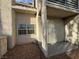Exterior angle of the condo showing a low maintenance gravel yard and the unit's entrance gate at 6250 W Flamingo Rd # 157, Las Vegas, NV 89103