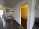 Hallway with wood-look floors leading to the kitchen and the room with carpet at 6250 W Flamingo Rd # 157, Las Vegas, NV 89103