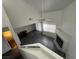 View of the living room and fireplace from the top of the stairs at 6250 W Flamingo Rd # 157, Las Vegas, NV 89103
