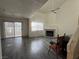 Living room featuring wood-look flooring, fireplace, and large sliding glass door at 6250 W Flamingo Rd # 157, Las Vegas, NV 89103