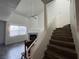 Bright living room with wood floors, a fireplace, ceiling fan, and staircase at 6250 W Flamingo Rd # 157, Las Vegas, NV 89103