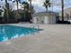 Exterior view of pool and building in the community and the beautiful clear sky at 6316 Beige Bluff St # 201, North Las Vegas, NV 89081