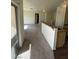 A naturally lit living room showcases a breakfast bar, and neutral carpet, creating a warm atmosphere at 6316 Beige Bluff St # 201, North Las Vegas, NV 89081