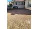 Low maintenance backyard with gravel, a bench, and a covered patio at 70 Belle Essence Ave, Las Vegas, NV 89123