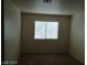 This bedroom features a window with blinds, neutral walls, and carpet at 70 Belle Essence Ave, Las Vegas, NV 89123