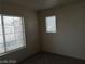 Bedroom with carpet, neutral walls, and a window with blinds at 70 Belle Essence Ave, Las Vegas, NV 89123
