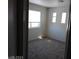 Cozy bedroom with neutral carpet, natural light, and spacious atmosphere at 70 Belle Essence Ave, Las Vegas, NV 89123