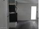 Spacious garage featuring an HVAC system and a door to the backyard at 70 Belle Essence Ave, Las Vegas, NV 89123