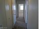 Neutral hallway featuring carpet and closet at 70 Belle Essence Ave, Las Vegas, NV 89123