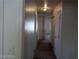 The hallway features carpet, a light fixture, and multiple doorways at 70 Belle Essence Ave, Las Vegas, NV 89123