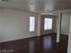 Inviting living room with hardwood floors, bright windows, and an open layout at 70 Belle Essence Ave, Las Vegas, NV 89123