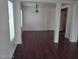 Spacious living room featuring hardwood floors, bright windows, and modern lighting at 70 Belle Essence Ave, Las Vegas, NV 89123