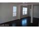Open-concept living room featuring hardwood floors, and natural light at 70 Belle Essence Ave, Las Vegas, NV 89123