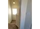 Carpeted staircase with natural light from a window, offering a cozy feel at 70 Belle Essence Ave, Las Vegas, NV 89123
