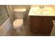 Bathroom with a toilet next to the cabinet with sink and silver faucet at 7290 Sheared Cliff Ln # 102, Las Vegas, NV 89149