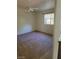 Spacious bedroom features a ceiling fan, a window letting in natural light, and neutral walls at 7290 Sheared Cliff Ln # 102, Las Vegas, NV 89149
